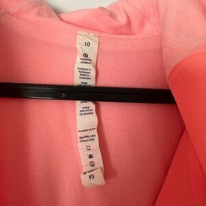 Coral hooded and lined rain/wind jacket.